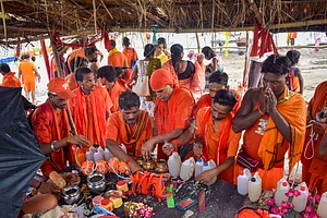 PTI : 'Kanwariyas' upon their return after collecting sacred water from Ganga river for Lord Shiva's worship during the holy month of 'Shravan', in Prayagraj,